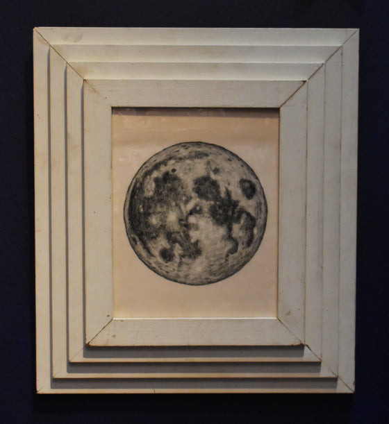 The Moon, presented in a Gluck frame