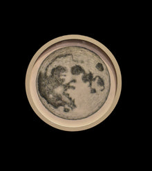  The Moon, presented in a small circular frame