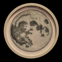  The Moon, presented in a medium sized circular frame