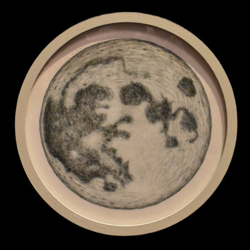 The Moon, presented in a medium sized circular frame